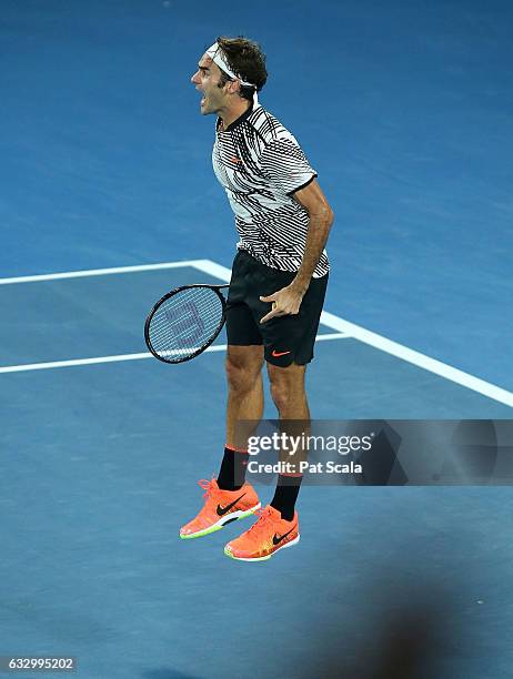Roger Federer of Switzerland celebrates winning the Men's Final match against Rafael Nadal of Spain on day 14 of the 2017 Australian Open at...