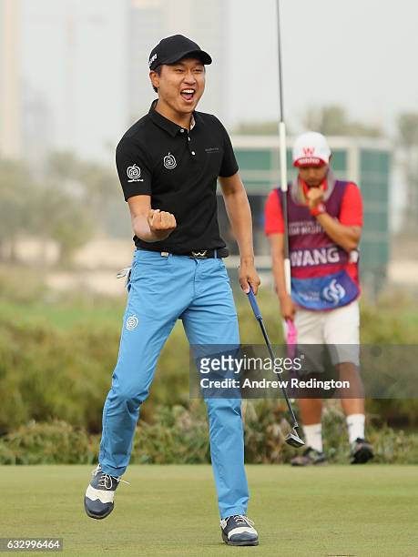Jeunghun Wang of South Korea celebrates his victory in the playoff during the fourth round of the Commercial Bank Qatar Masters at the Doha Golf Club...