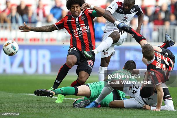 Nice's Brazilian defender Dante vies with Guingamp's French midfielder Yannis Salibur during the French L1 football match Nice vs Guingamp on January...