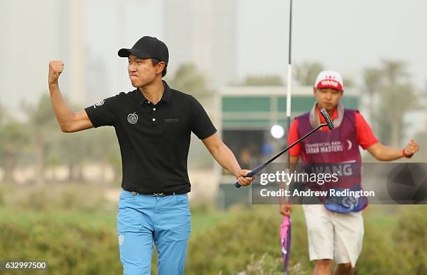 Jeunghun Wang of South Korea celebrates his victory in the playoff during the fourth round of the Commercial Bank Qatar Masters at the Doha Golf Club...