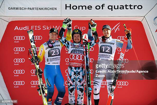 Matts Olsson of Sweden takes 2nd place, Marcel Hirscher of Austria takes 1st place, Stefan Luitz of Germany takes 3rd place during the Audi FIS...