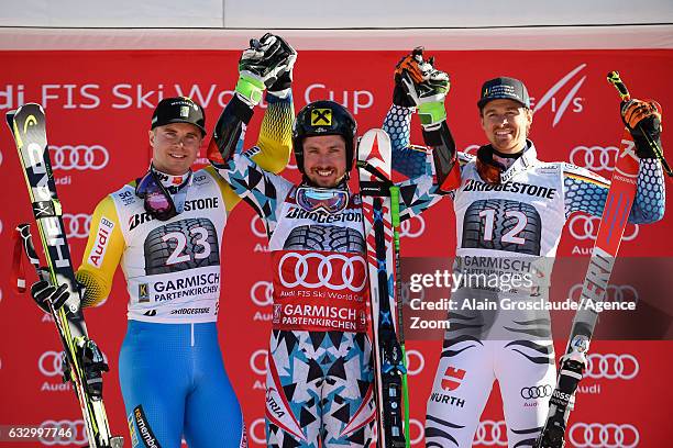 Matts Olsson of Sweden takes 2nd place, Marcel Hirscher of Austria takes 1st place, Stefan Luitz of Germany takes 3rd place during the Audi FIS...