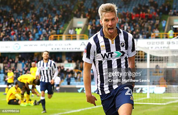 Steve Morison of Millwall celebrates scoring his sides first goal during The Emirates FA Cup Fourth Round match between Millwall and Watford at The...