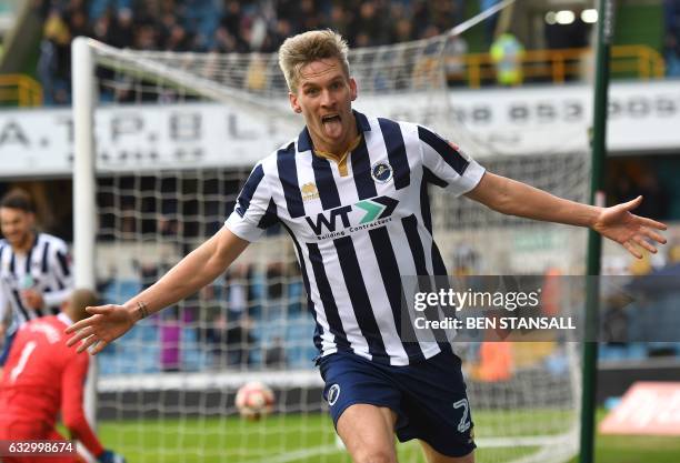 Millwall's English-born Welsh striker Steve Morison celebrates after scoring the opening goal of the English FA Cup fourth round football match...