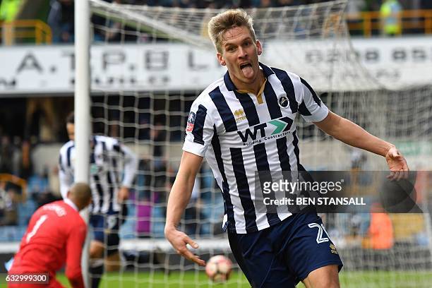 Millwall's English-born Welsh striker Steve Morison celebrates after scoring the opening goal of the English FA Cup fourth round football match...