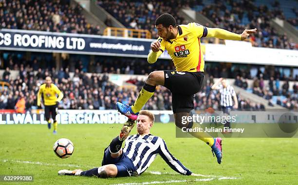 Byron Webster of Millwall attempts to block Troy Deeney of Watford shot during The Emirates FA Cup Fourth Round match between Millwall and Watford at...