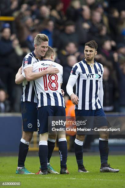 Millwall's Steve Morison celebrates scoring the opening goal with team mate Shane Ferguson during the Emirates FA Cup Fourth Round match between...