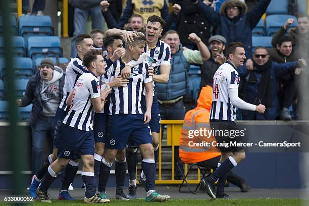 Millwall's Steve Morison celebrates scoring the opening goal with team mates during the Emirates FA Cup Fourth Round match between Millwall and...
