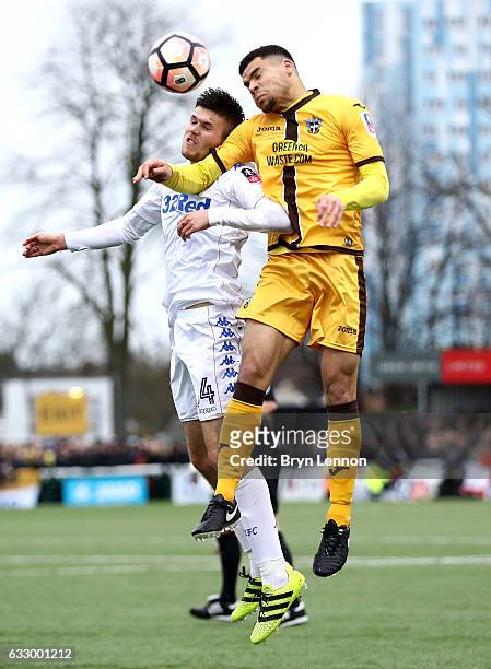 Paul McKay of Leeds United and Maxime Biamou of Sutton United battle to win a header during The Emirates FA Cup Fourth Round match between Sutton...