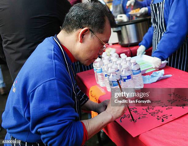 Man writes names in Chinese writing during the Chinese New Year celebrations to mark The Year of the Rooster on January 29, 2017 in Newcastle Upon...