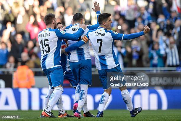Espanyol's midfielder Jose Antonio Reyes is congratulated by teammates after scoring a goal during the Spanish league football match RCD Espanyol vs...