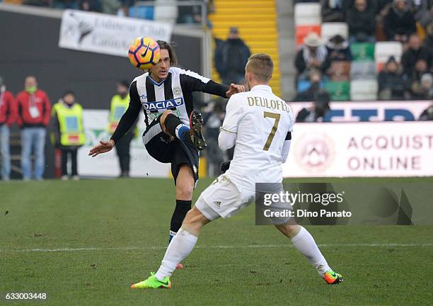 Gabriele Angella of Udinese Calcio competes with Gerard Deulofeu of AC Milan during the Serie A match between Udinese Calcio and AC Milan at Stadio...