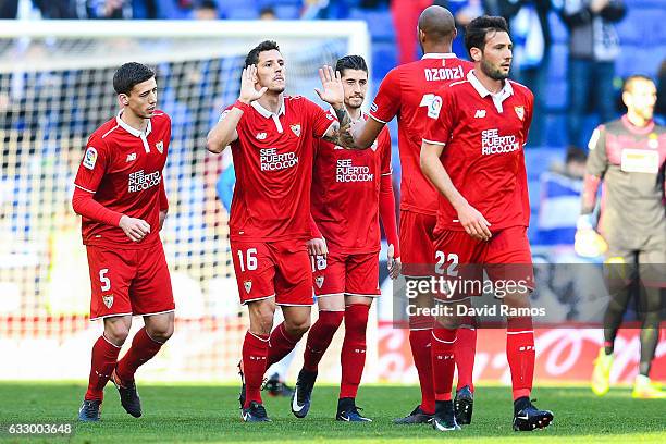 Stevan Jovetic of Sevilla FC celebrates with his team mates after scoring his team's first goal during the La Liga match between RCD Espanyol and...