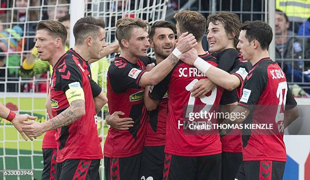 Freiburg's midfielder Janik Haberer and his teammates celebrate the goal during the German first division Bundesliga football match between SC...