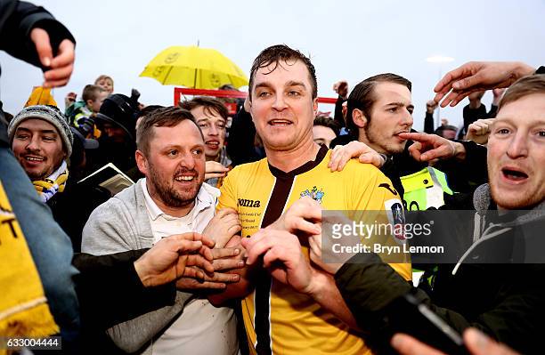 Jamie Collins of Sutton United celebrates with the Sutton United fans after the Emirates FA Cup Fourth Round match between Sutton United and Leeds...