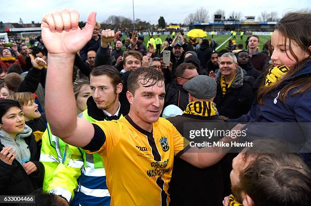 Jamie Collins of Sutton United celebrates with the Sutton United fans after the Emirates FA Cup Fourth Round match between Sutton United and Leeds...