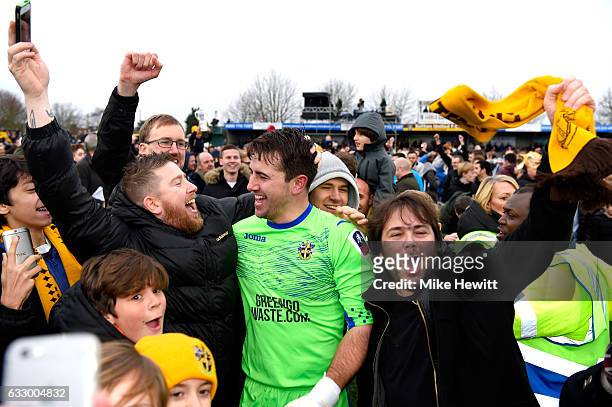 Ross Worner of Sutton United celebrates with the Sutton United fans after the Emirates FA Cup Fourth Round match between Sutton United and Leeds...