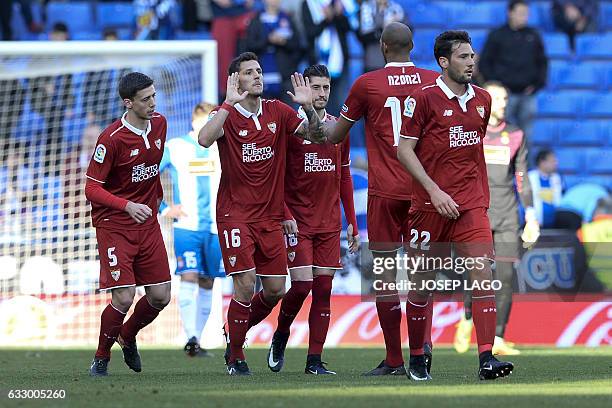 Sevilla's Montenegrin forward Stevan Jovetic celebrates his goal with Sevilla's French midfielder Steven N'Zonzi during the Spanish league football...