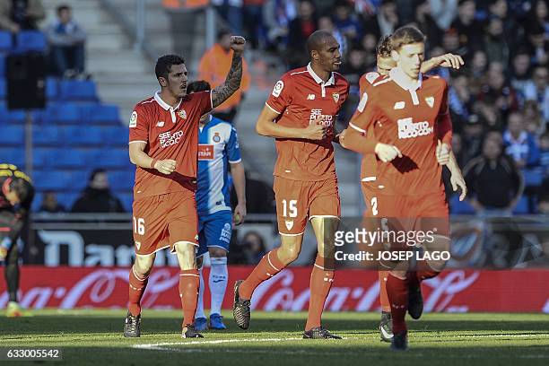 Sevilla's Montenegrin forward Stevan Jovetic celebrates his goal beside Sevilla's French midfielder Steven N'Zonzi during the Spanish league football...