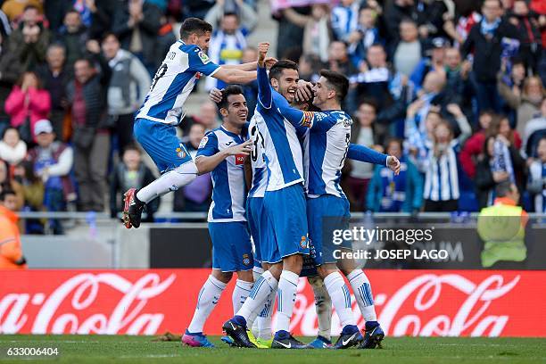 Espanyol's defender Marc Navarro celebrates a goal with teammates during the Spanish league football match RCD Espanyol vs Sevilla FC at the...