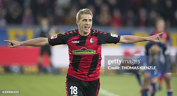 Freiburg's forward Nils Petersen celebrates his goal during the German first division Bundesliga football match between SC Freiburg and Hertha Berlin...