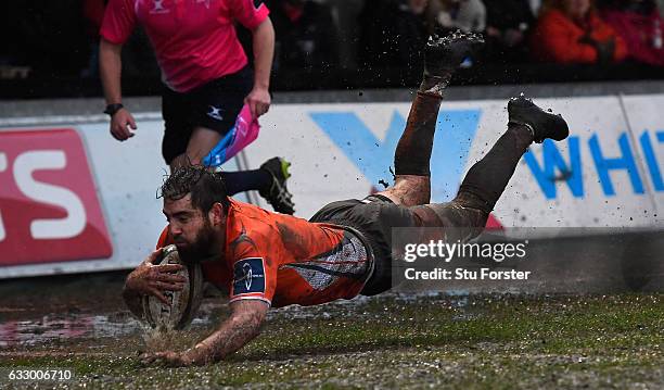 Falcons wing Belisario Agulla dives over the line to score during the Anglo- Welsh Cup match between Newport Gwent Dragons and Newcastle Falcons at...