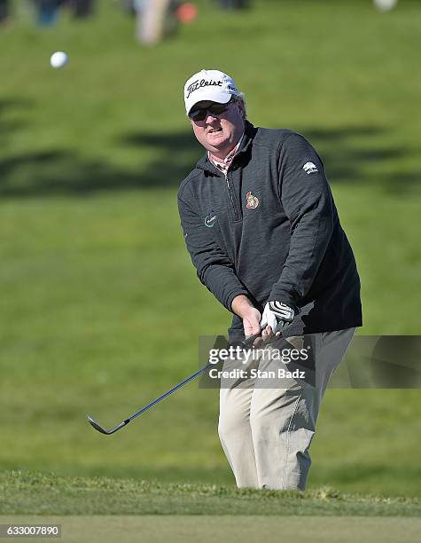 Brad Fritsch of Canada plays a chip shot on the 18th hole during the second round of the Farmers Insurance Open at Torrey Pines Golf Course on...