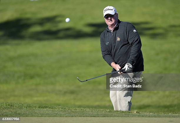 Brad Fritsch of Canada plays a chip shot on the 18th hole during the second round of the Farmers Insurance Open at Torrey Pines Golf Course on...