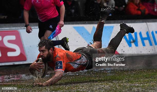 Falcons wing Belisario Agulla dives over the line to score during the Anglo- Welsh Cup match between Newport Gwent Dragons and Newcastle Falcons at...