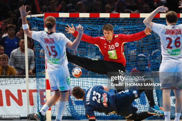 France's pivot Ludovic Fabregas scores a goal as Norway's goalkeeper Torbjorn Bergerud stretches out during the 25th IHF Men's World Championship...