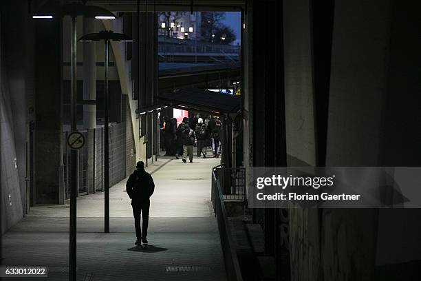 The silhouette of a walking man is captured at a train station on January 27, 2017 in Berlin, Germany.