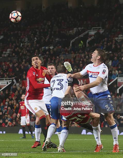 Bastian Schweinsteiger of Manchester United in action with Stephen Warnock and Jake Buxtonof Wigan Athletic during the Emirates FA Cup Fourth Round...