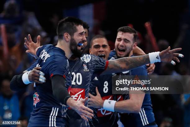 France's centre back Nikola Karabatic, France's centre back Daniel Narcisse and France's right back Nedim Remili celebrate after winning the 25th IHF...
