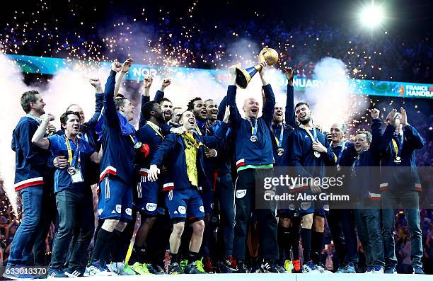 Thierry Omeyer of France lifts the trophy as he celebrates victory with team mates during the 25th IHF Men's World Championship 2017 Final between...