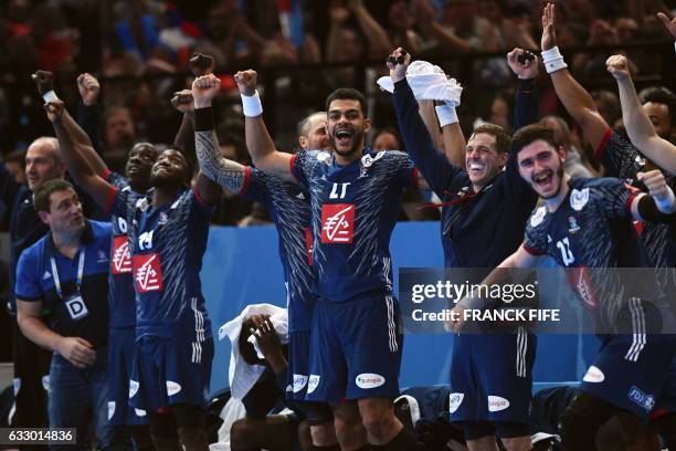 France's right back Adrien Dipanda , France's pivot Ludovic Fabregas and teammates react seconds before winning the 25th IHF Men's World Championship...