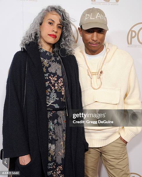 Mimi Valdes and singer Pharrell Williams arrive at the 28th Annual Producers Guild Awards at The Beverly Hilton Hotel on January 28, 2017 in Beverly...