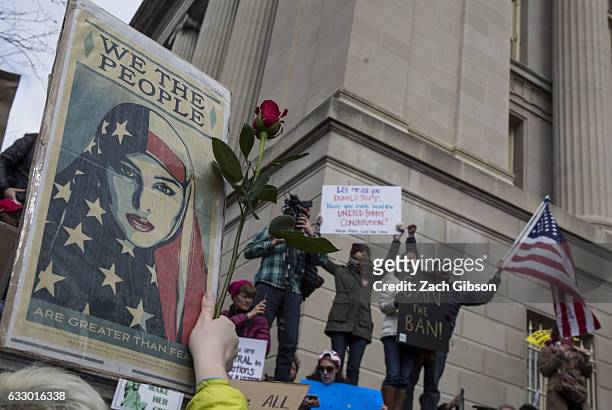 Demonstrators gather near The White House to protest President Donald Trump's travel ban on seven Muslim countries on January 29, 2017 in Washington,...