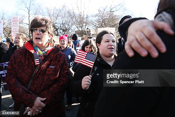 People attend an afternoon rally in Battery Park to protest U.S. President Donald Trump's new immigration policies on January 29, 2017 in New York...