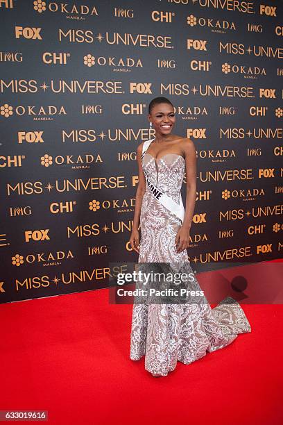 Miss Sierra Leone smiles to the press at the SMX in Pasay City. Miss Universe candidates walked the red carpet at the SMX in Pasay City a day before...