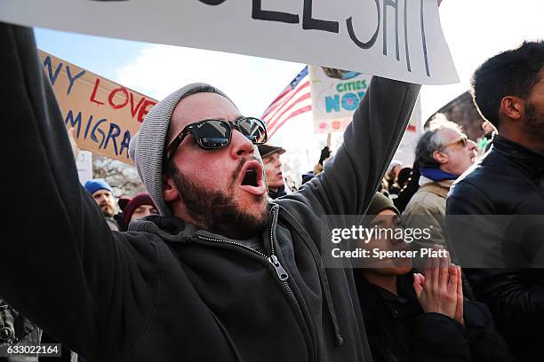 People attend an afternoon rally in Battery Park to protest U.S. President Donald Trump's new immigration policies on January 29, 2017 in New York...