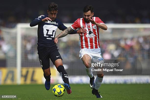 Jose Carlo Van Rankin of Pumas fights for the ball with Luis Gallegos of Necaxa during the 4th round match between Pumas UNAM and Necaxa as part of...
