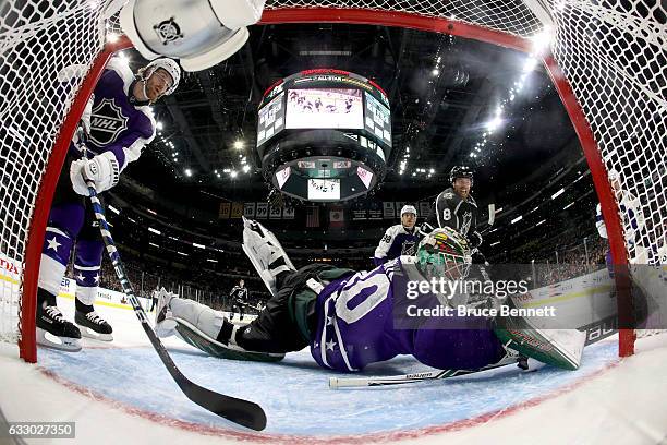 Devan Dubnyk of the Minnesota Wild attempts to make a save against Joe Pavelski of the San Jose Sharks during the 2017 Honda NHL All-Star Game...