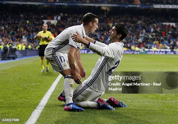 Alvaro Morata of Real Madrid celebrates with Lucas Vazquez after scoring their team's third goal during the La Liga match between Real Madrid and...