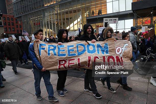 People march in lower Manhattan to protest U.S. President Donald Trump's new immigration policies on January 29, 2017 in New York City. Trump's...