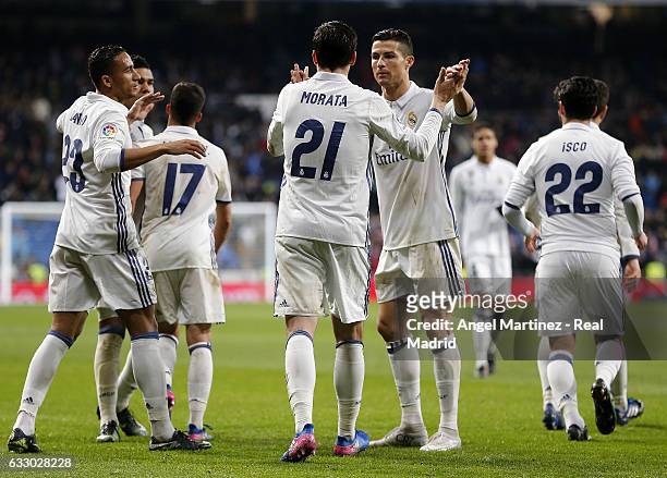 Alvaro Morata of Real Madrid celebrates with Cristiano Ronaldo after scoring their team's third goal during the La Liga match between Real Madrid and...