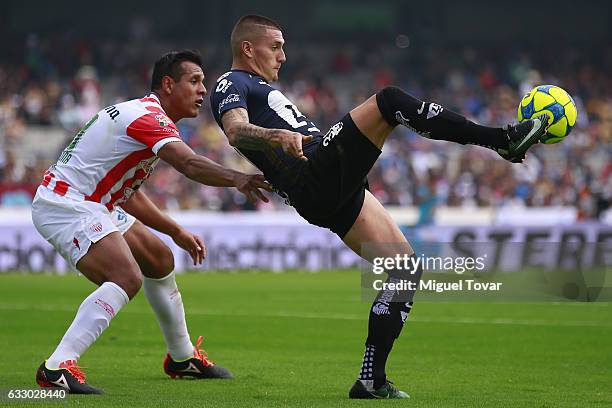 Nicolas Castillo of Pumas controls the ball under pressure of Marcos Gonzalez of Necaxa during the 4th round match between Pumas UNAM and Necaxa as...