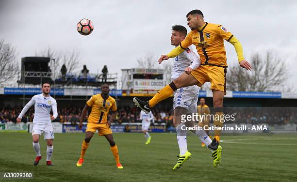 Paul McKay of Leeds United and Maxime Biamou of Sutton United during the Emirates FA Cup Fourth Round match between Sutton United and Leeds United at...
