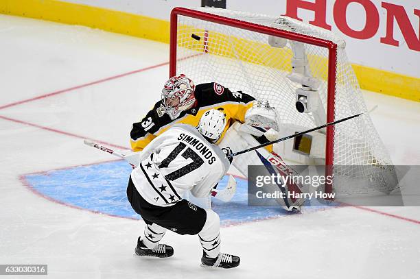 Wayne Simmonds of the Philadelphia Flyers scores a goal against Carey Price of the Montreal Canadiens during the 2017 Honda NHL All-Star Game...