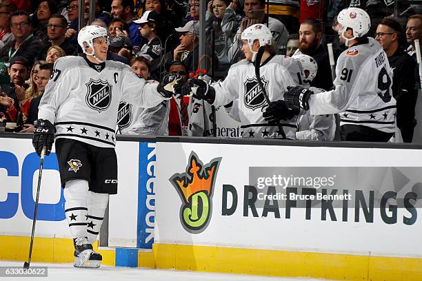 Sidney Crosby of the Pittsburgh Penguins celebrates with teammates after scoring a goal during the 2017 Honda NHL All-Star Game Semifinal at Staples...