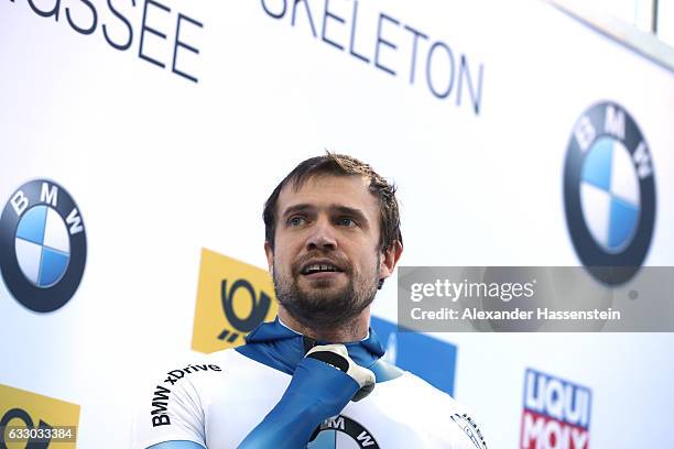 Alexander Tretiakov of Russia looks on after the Men's Skeleton second run of the BMW IBSF World Cup at Deutsche Post Eisarena Koenigssee on January...